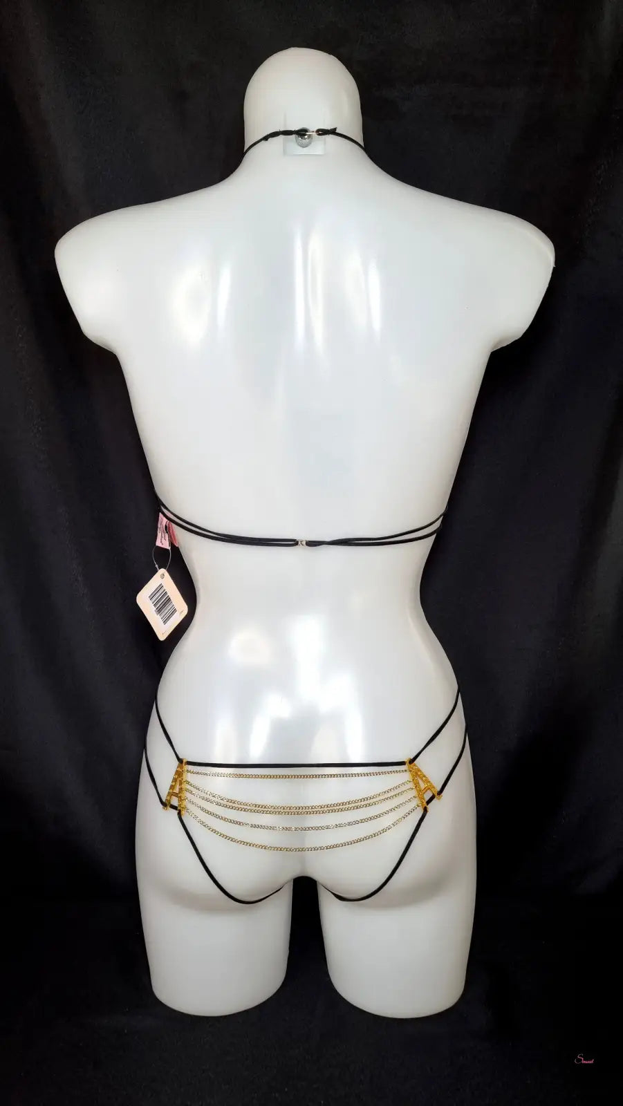 Černé dvoudílné plavky Agent Provocateur Playsuit Avery s zlatými řetízky na bílé figuríně