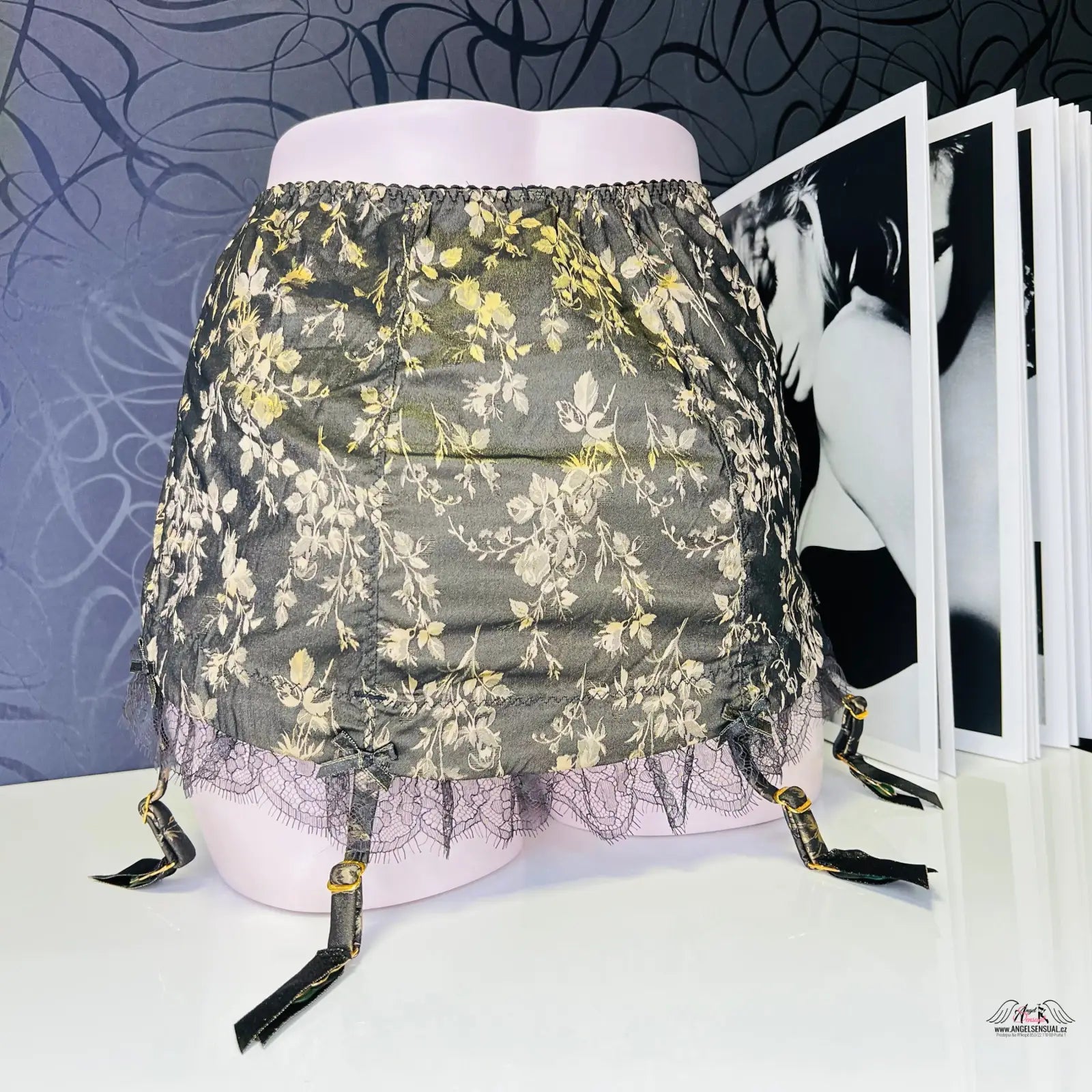 Black lace garter skirt with gold floral embroidery and adjustable straps, enigmatický leoni roll