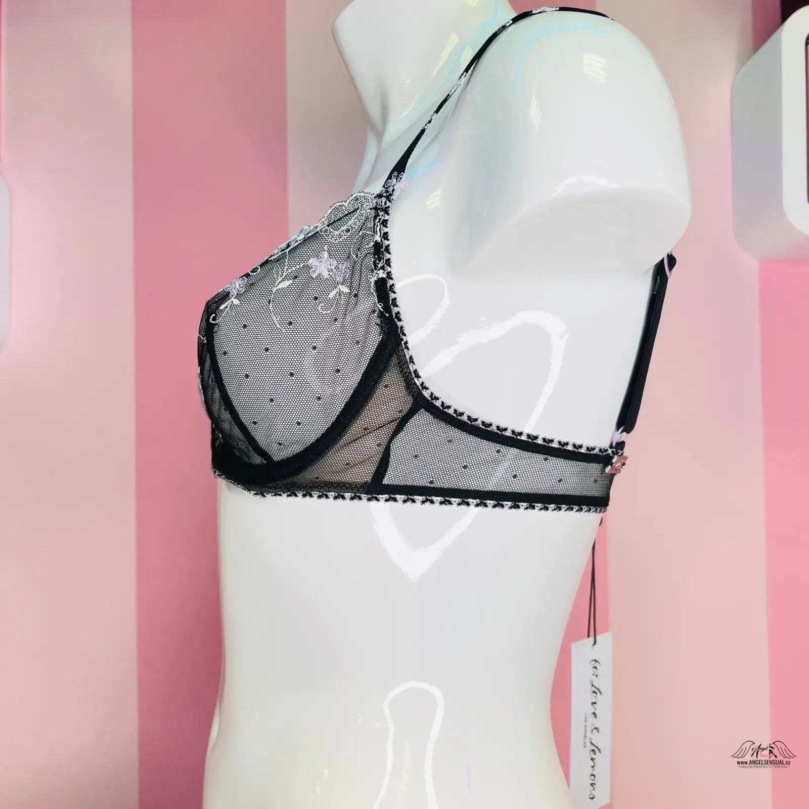 Průsvitná černá a šedá krajková podprsenka se zdobením z rhinestone na figuríně