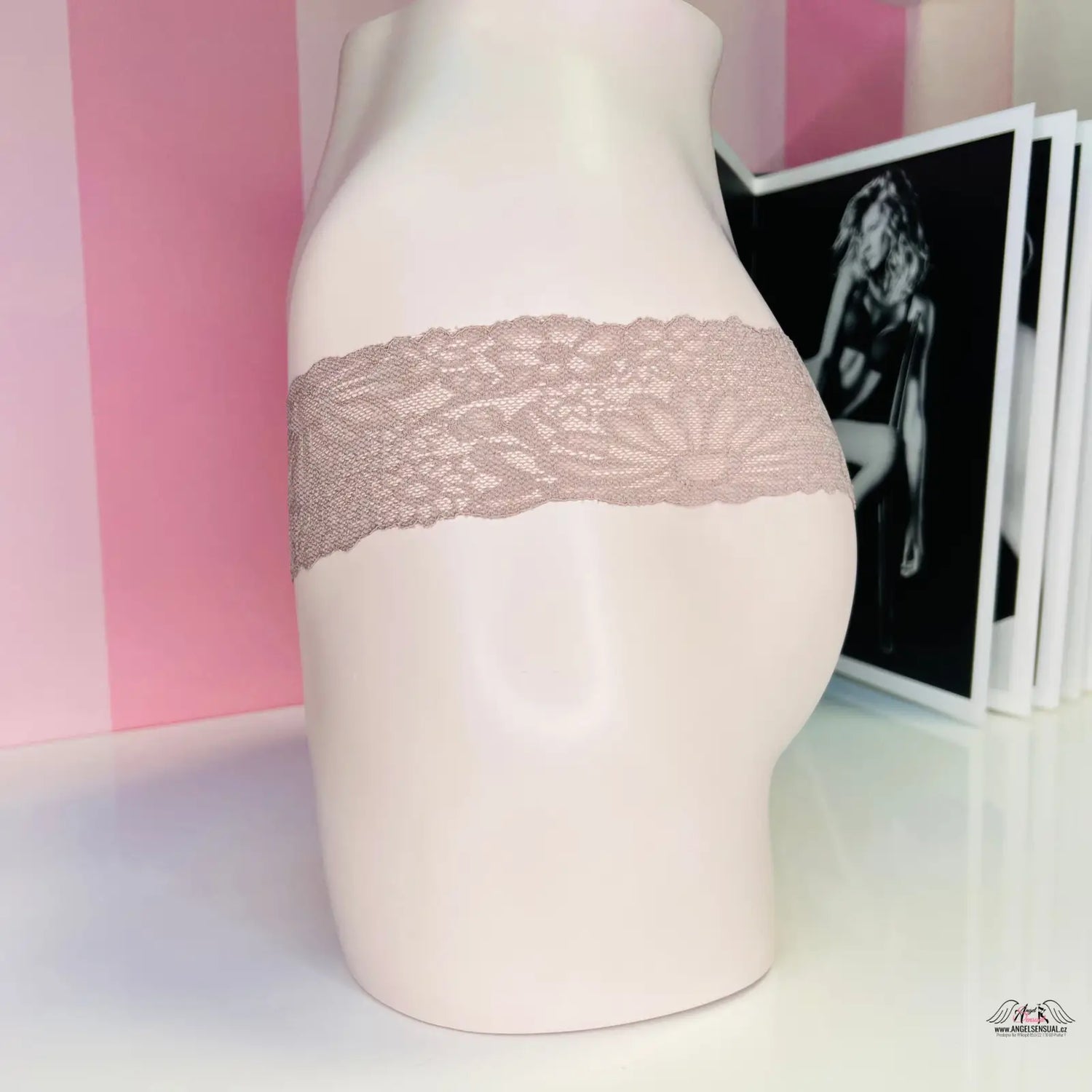 Lace-trimmed mannequin torso displaying PINK Tanga s Krajkou in barevné tanga style