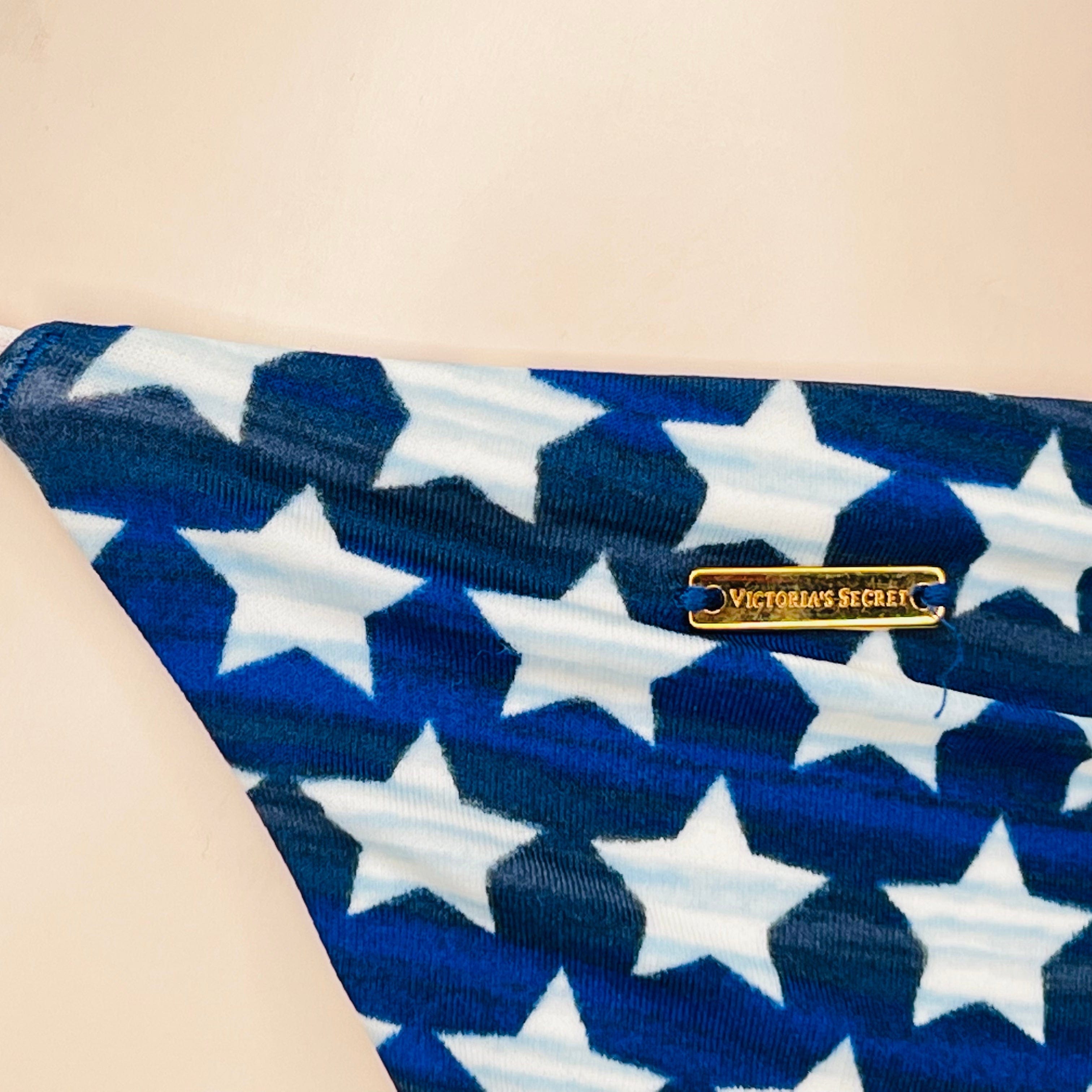 Blue fabric with white stars and Victoria’s Secret label, spodní díl plavek s motivem americké vlajky
