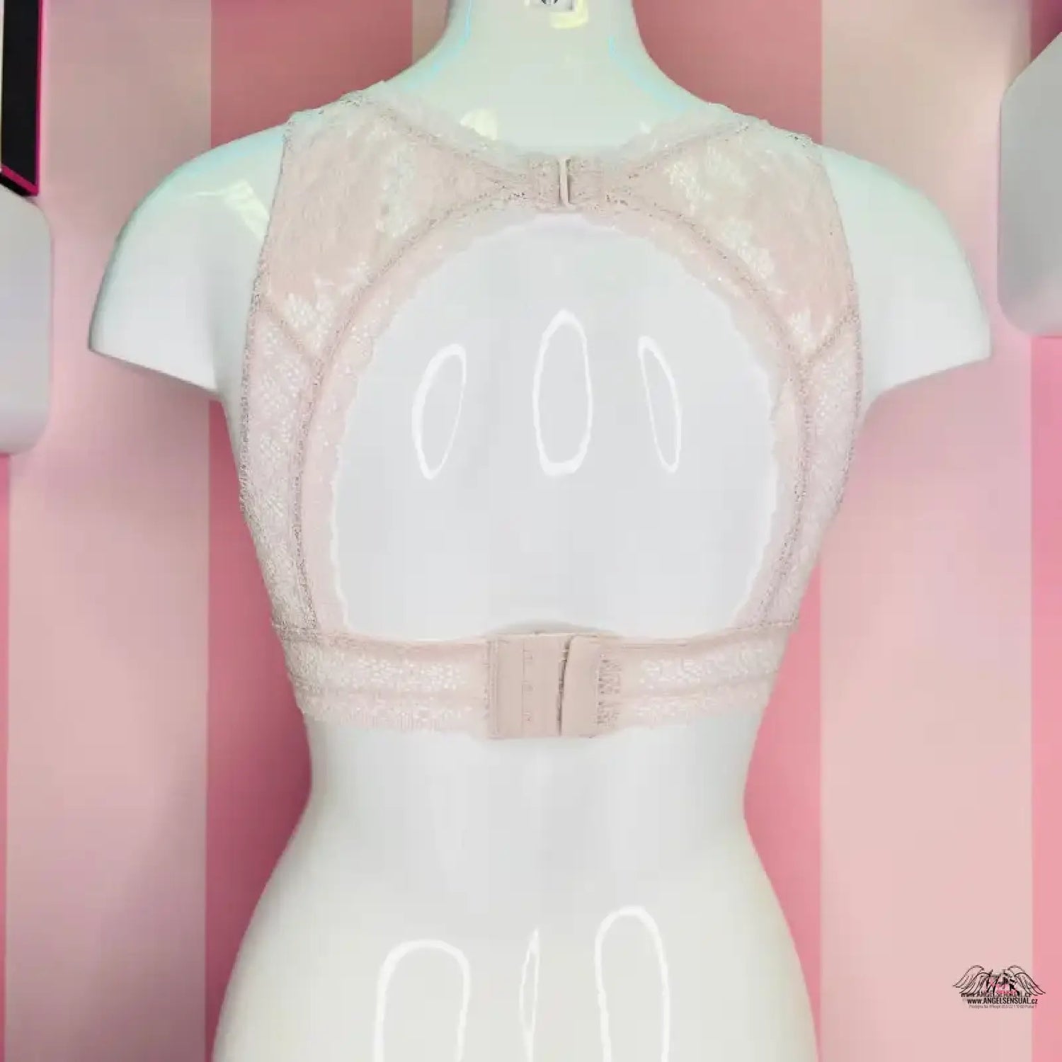 Lace-trimmed beige bra on mannequin for Victoria’s Secret lingerie apparel & accessories