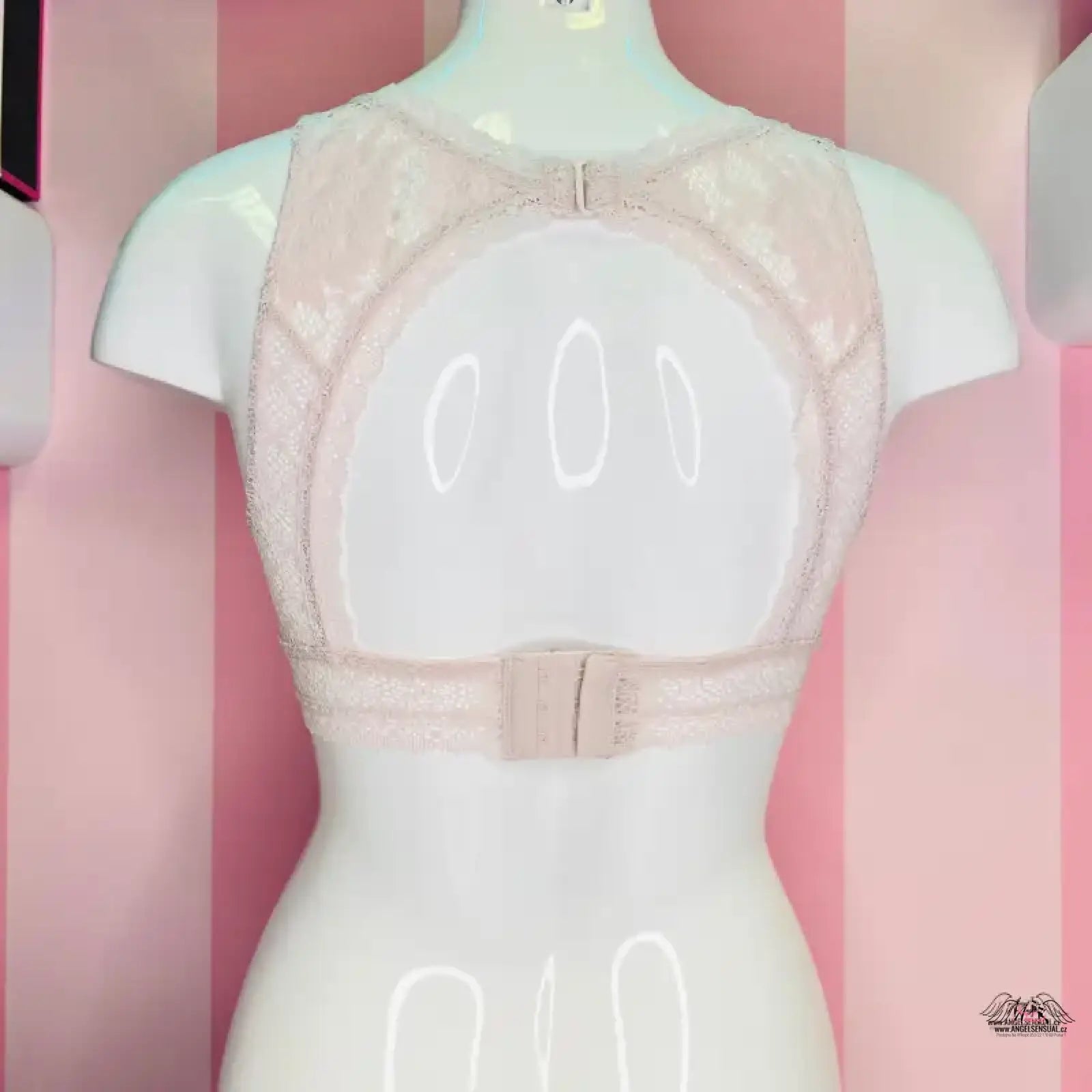 Lace-trimmed beige bra on mannequin for Victoria’s Secret lingerie apparel & accessories