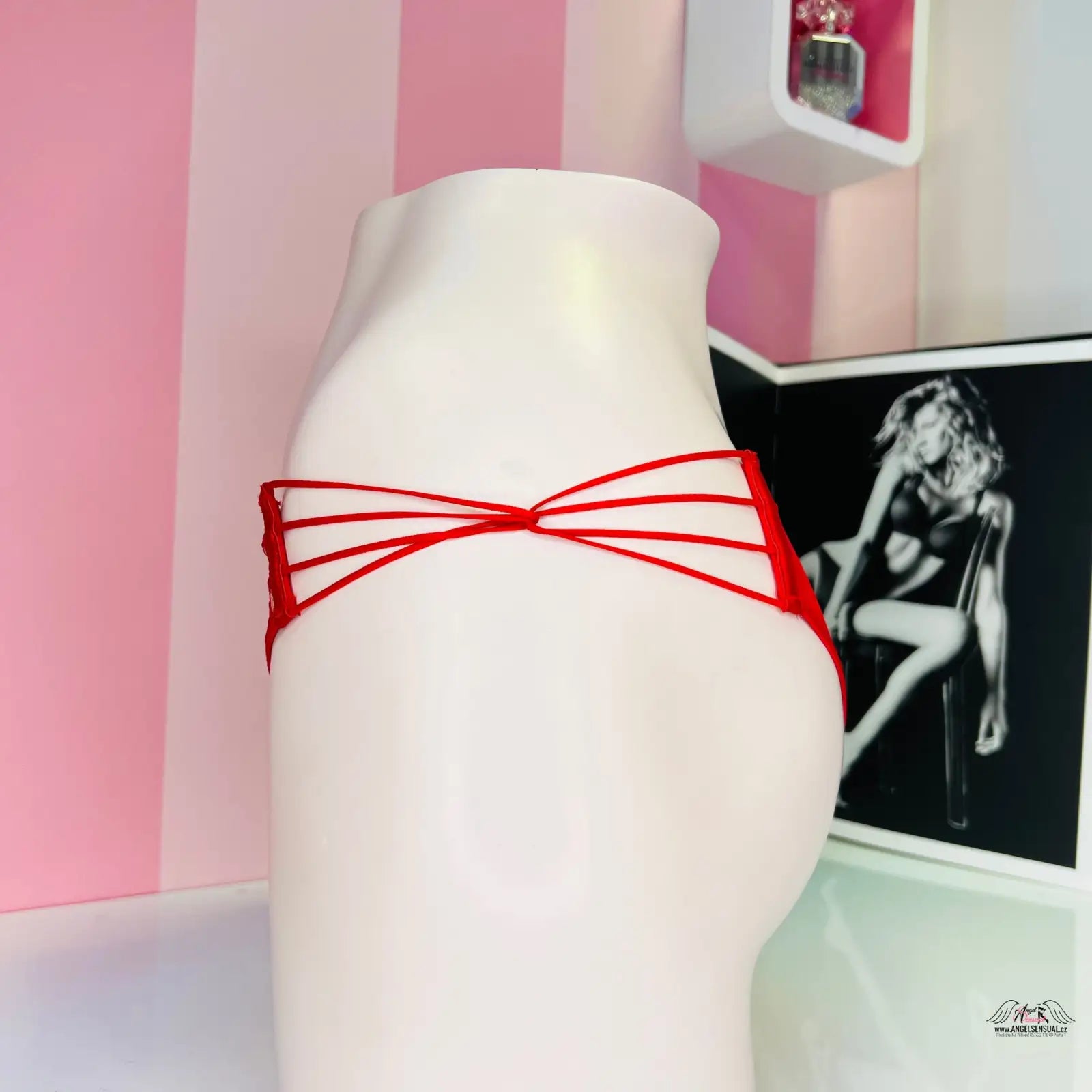 Mannequin with a red string showcasing Agent Provocateur’s elegant design