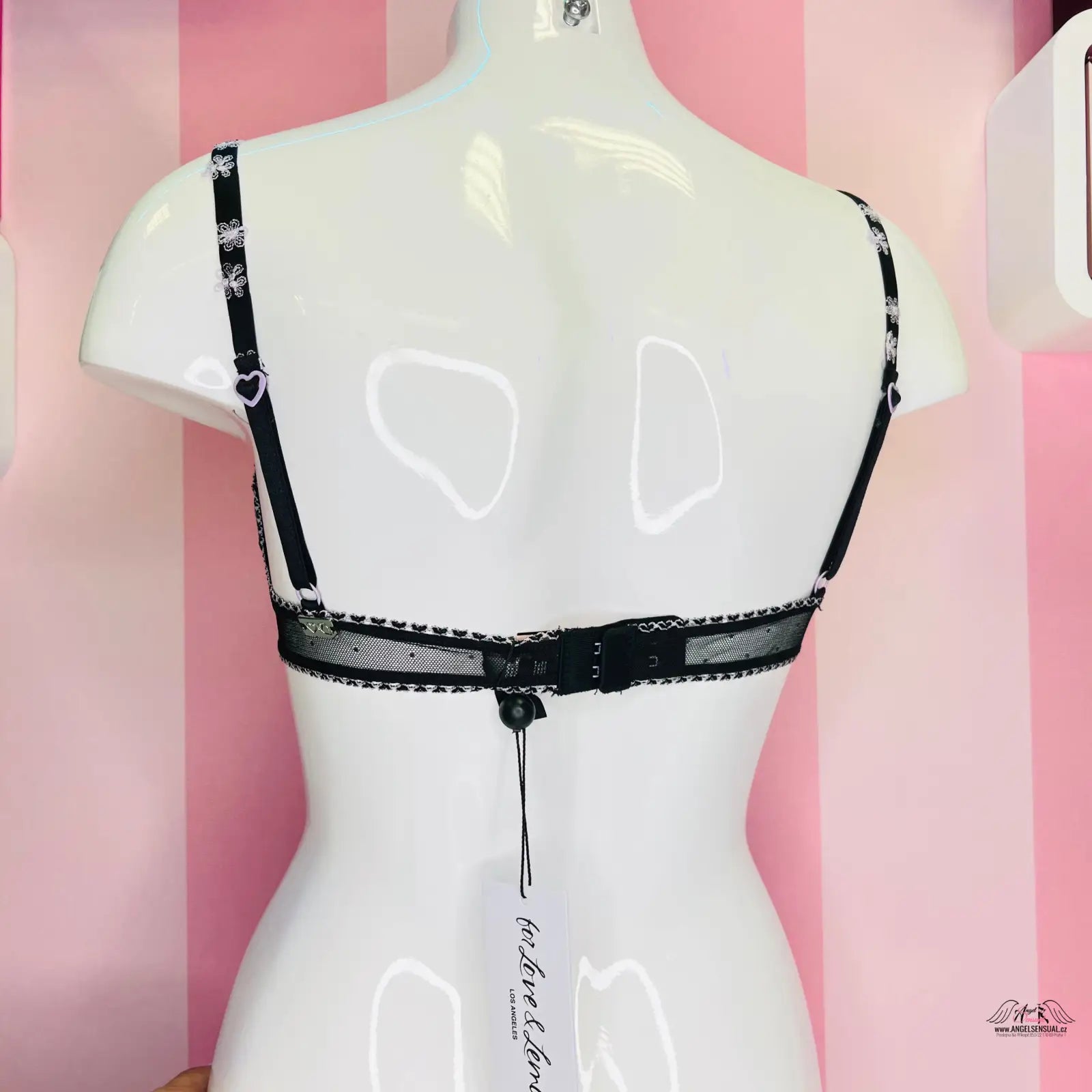 Bílá figurína s černou síťovanou podprsenkou Victoria’s Secret for Love and Lemons