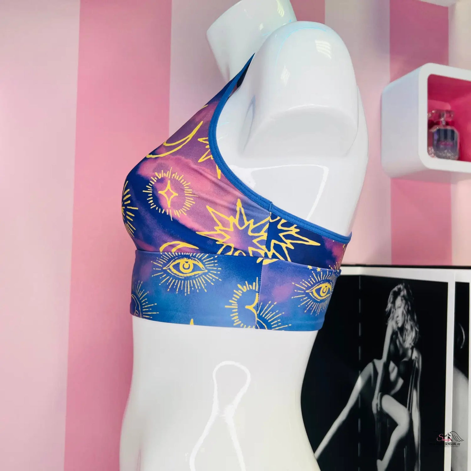 Elegantní sportovní podprsenka Victoria’s Secret s modrým a růžovým designem s očima a sluncem