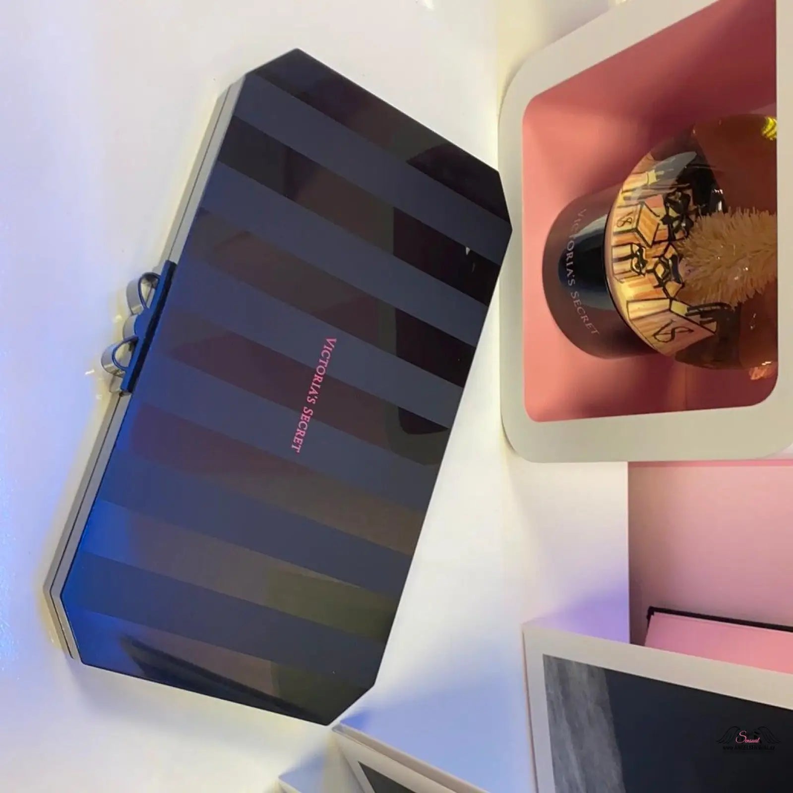 Striped black clutch from Victoria’s Secret Ultimate Bombshell Makeup Kit, apparel & accessories