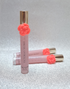Victoria’s Secret Tease Flower perfume rollerballs with coral flower accents