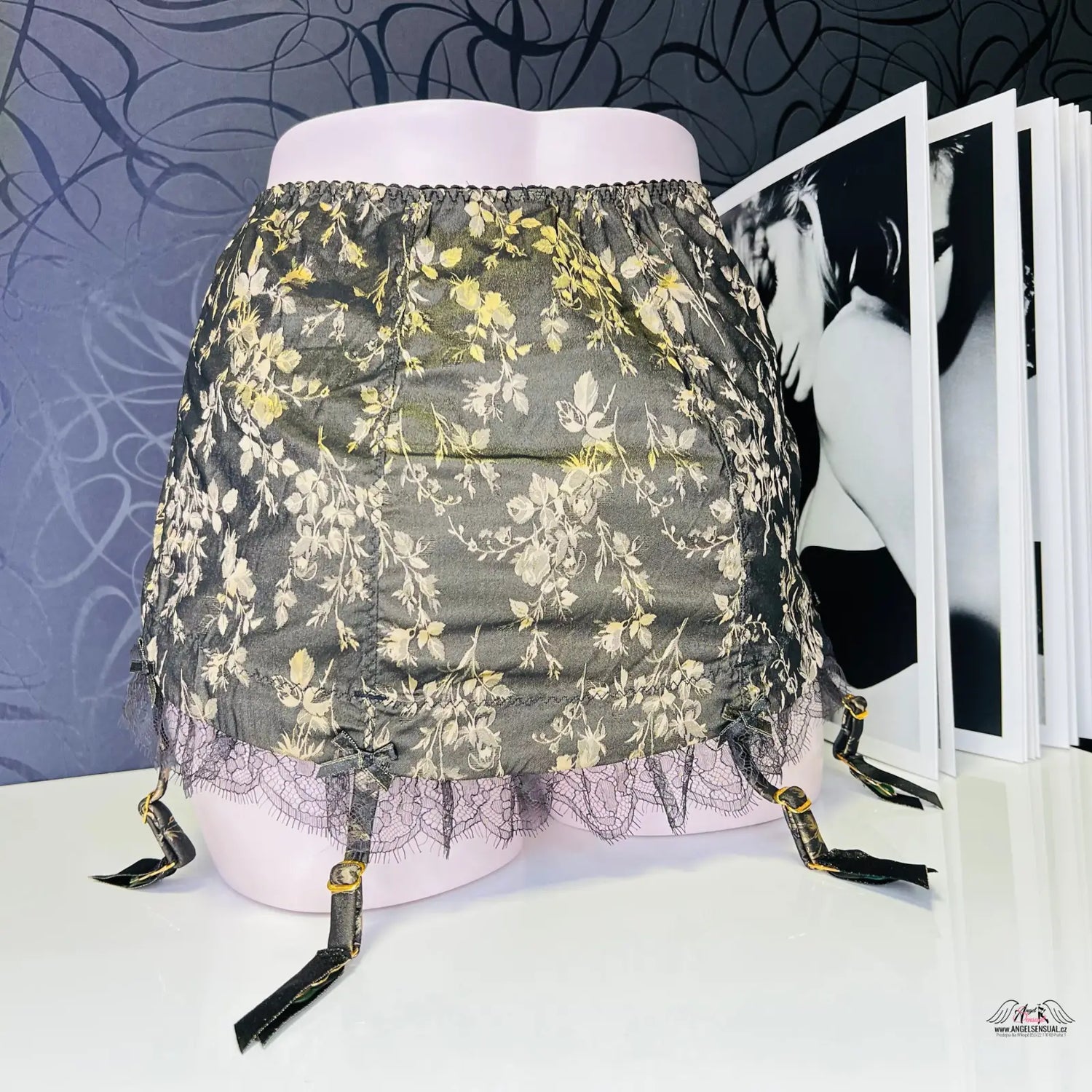 Black lace garter skirt with gold floral embroidery and adjustable straps, enigmatický leoni roll