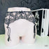 Black lace garter belt on mannequin showcasing Podvazkový Pás Xiah Krajkový