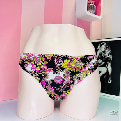 Floral print bikini bottom with black background and colorful flowers from Barevný zázrak