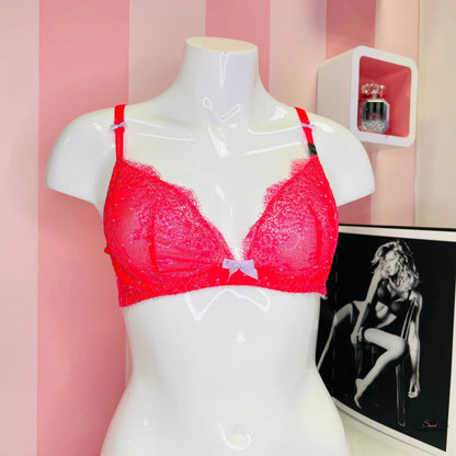 Red bra displayed with a black and white photo of a woman from Braletka collection