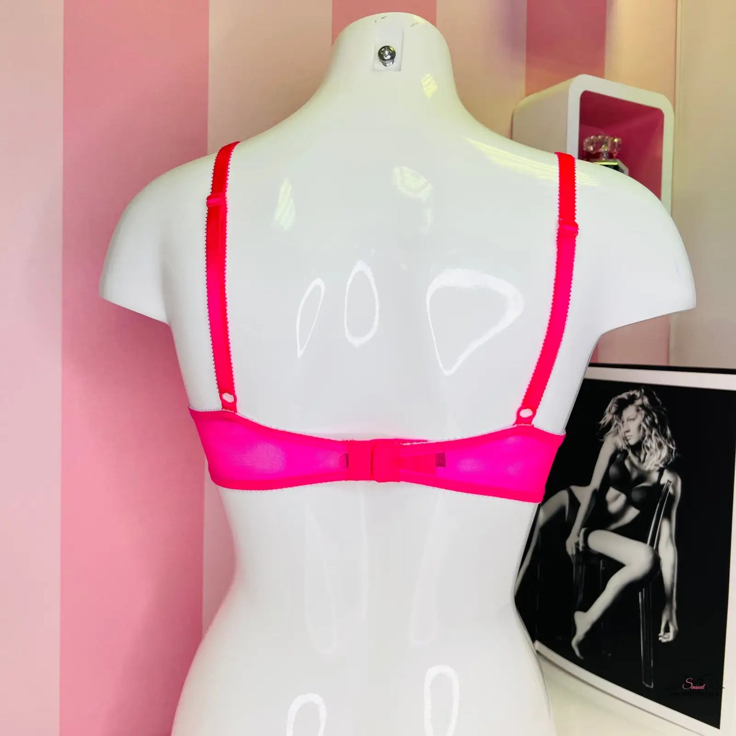 Mannequinn in pink bralette top with lace showcased in black and white photo