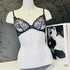 Lace-trimmed black and white bra on a mannequin for Elegantní Larreta Bra