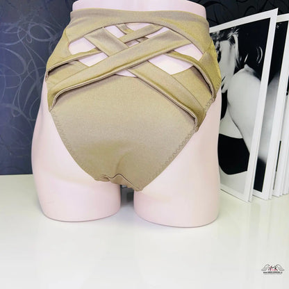 Beige plavkový spodek s křížovými popruhy na torzu manekýna