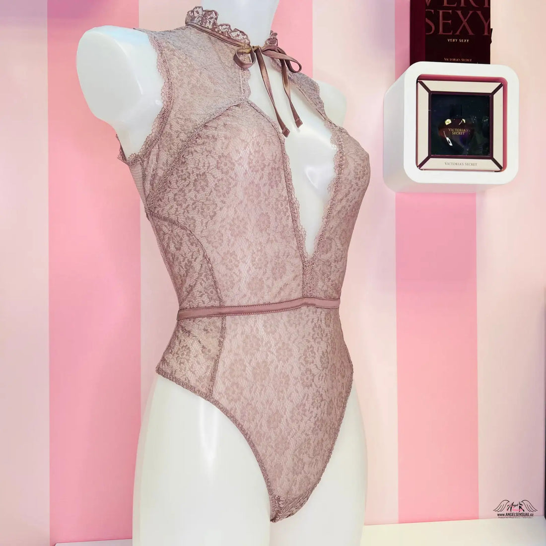 Pale pink lace bodysuit with plunging neckline and shoulder ties from Tanga