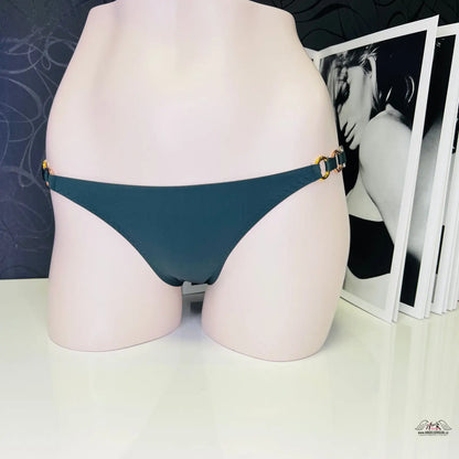 Teal bikini bottom on a pale mannequin torso for stylish summer fashion