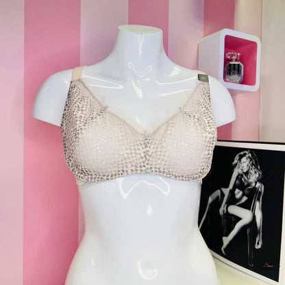 Araffed mannequin with a bra and a picture of a woman in Victoria’s Secret lingerie