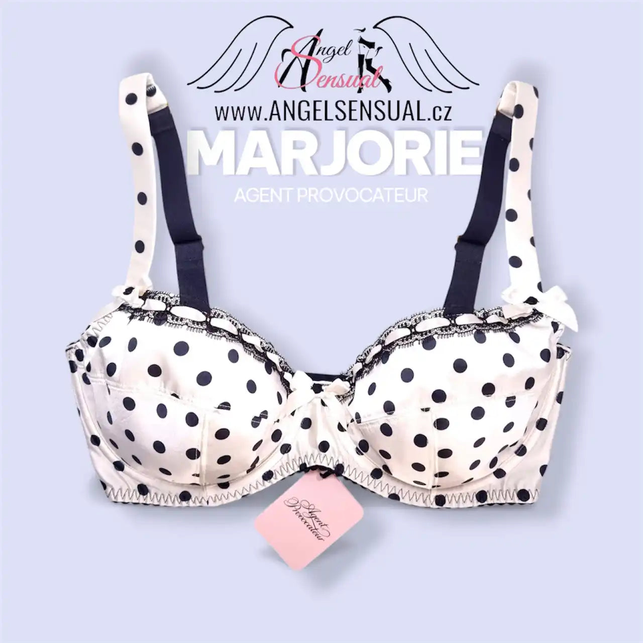 Tečkovaná podprsenka s bílými a černými tečkami, polstrované košíčky, nastavitelná ramínka, krajkový lem.