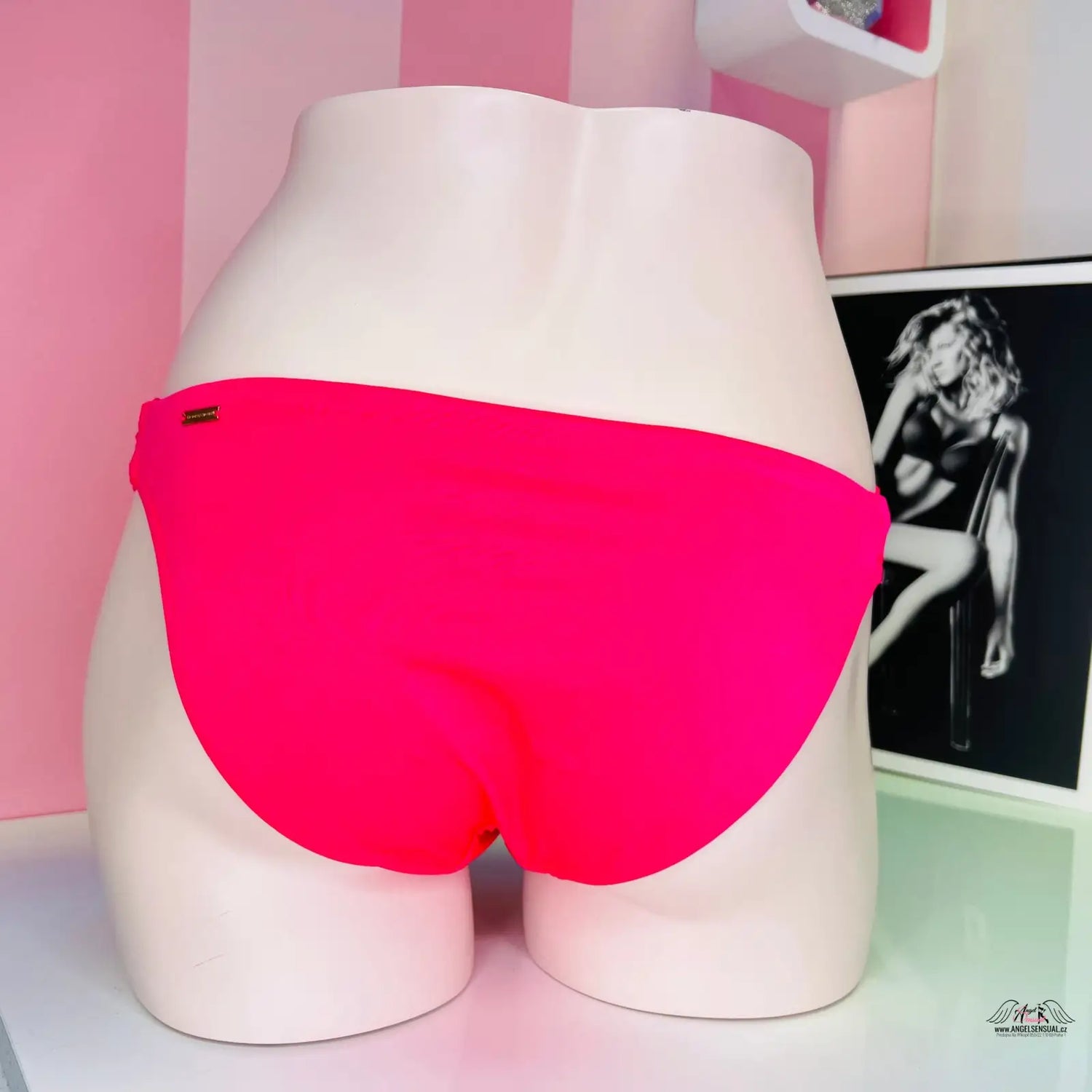 Hot pink bikini bottoms with shiny accents for a sophisticated look