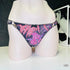 Floral print thong with black lace trim from Riva Kalhotky for stylish lingerie elegance