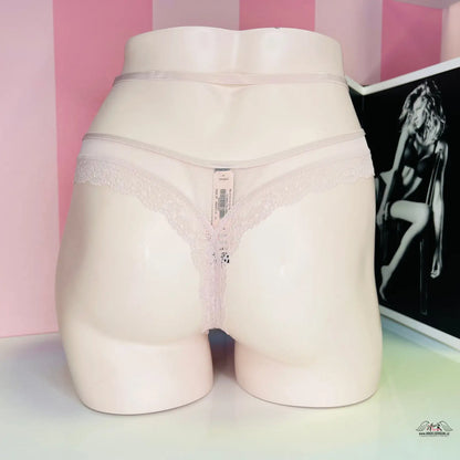 Lace-trimmed thong panties displayed on a mannequin for Tanga Krémové Elegance