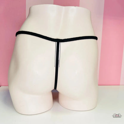 Bílý manekýn s černým tangem, elegantní krajková spodní prádlo Tanga