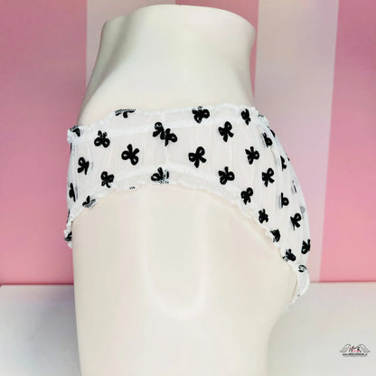 Průsvitné kalhotky Victoria’s Secret s mašličkami a otvory na zadní straně