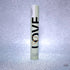 Victoria’s Secret Love Rollerball perfume in light green tube with black and gold lettering
