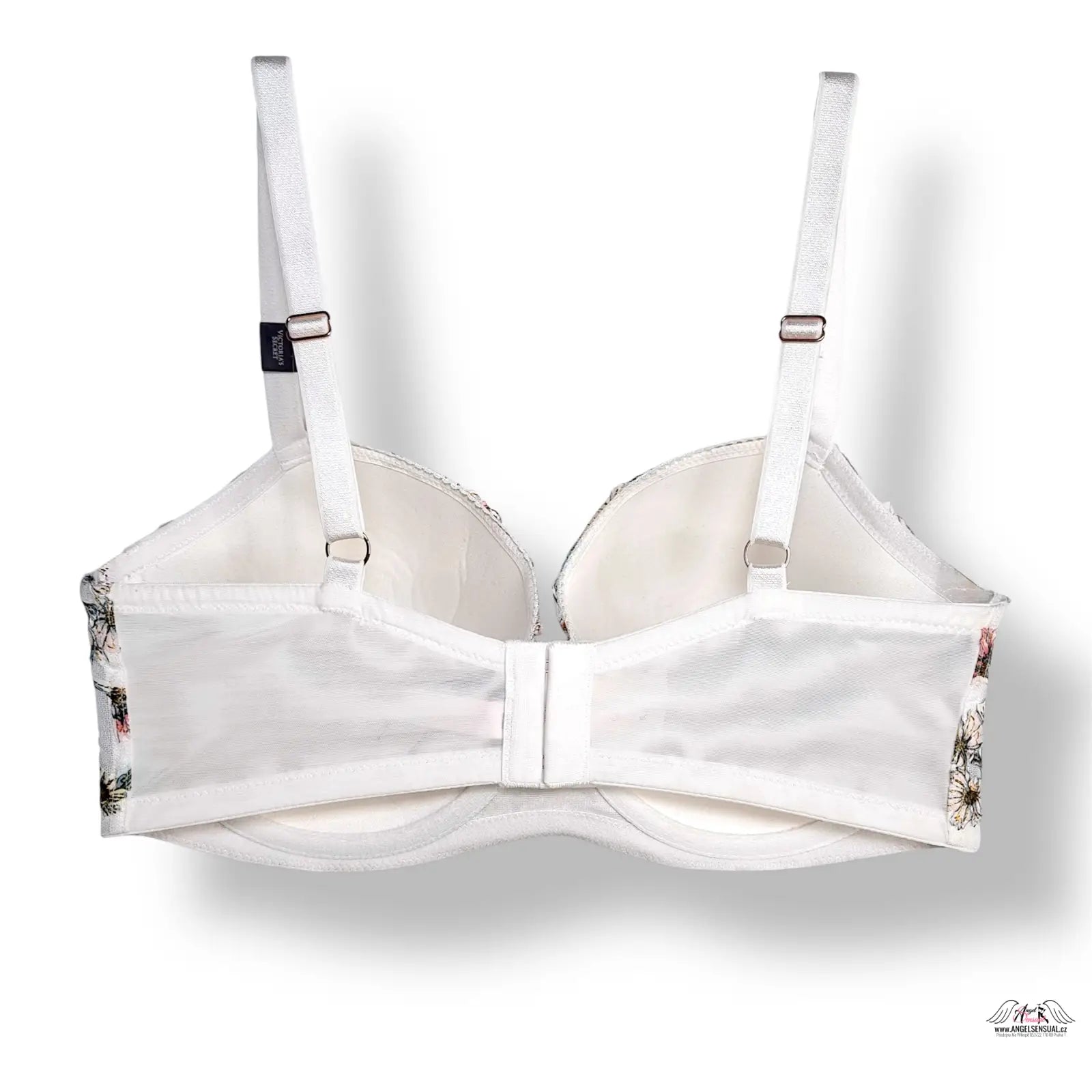 Elegantní bílá podprsenka s květinovým vzorem a stříbrným hardwarem