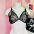 Black lace bra with jemnou síťovinou and elegantními proužky displayed on a white mannequin