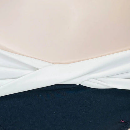 White fabric twisted and draped over dark surface, spodní díl plavek Whi/Bla s překříženými pásky