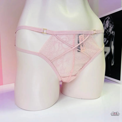 Pink lace and mesh Victoria’s Secret Strappy Tanga displayed on mannequin form